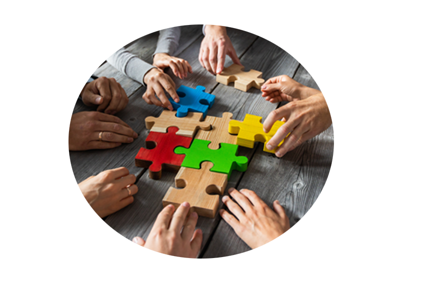 business people team sitting around meeting table assembling color jigsaw puzzle pieces unity cooperation ideas concept